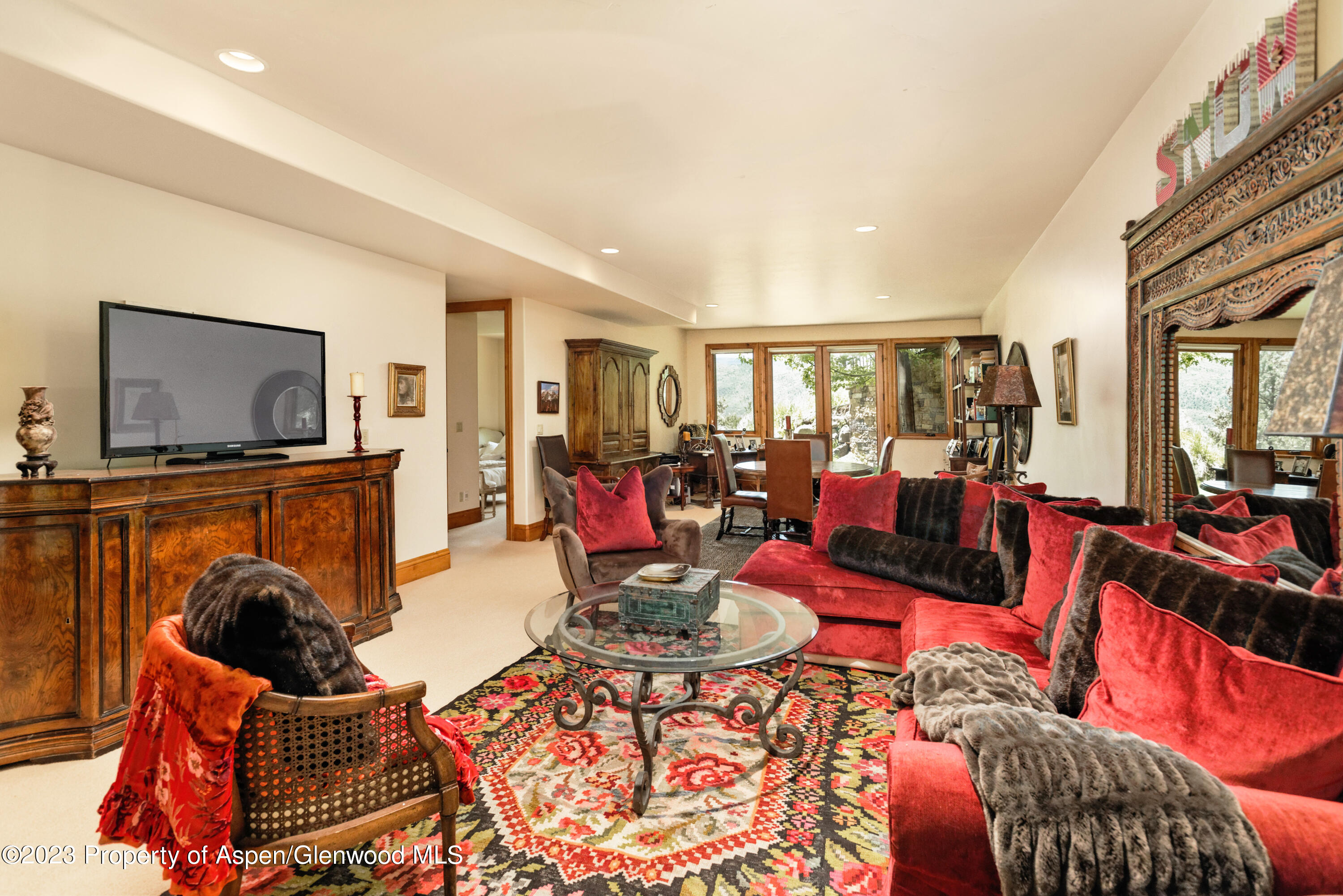 121 Ridge Road Basalt, CO 81621 - Photo 19 of 25 a living room with furniture a flat screen tv and a dining table