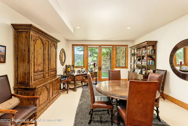 a living room with fireplace furniture and a window