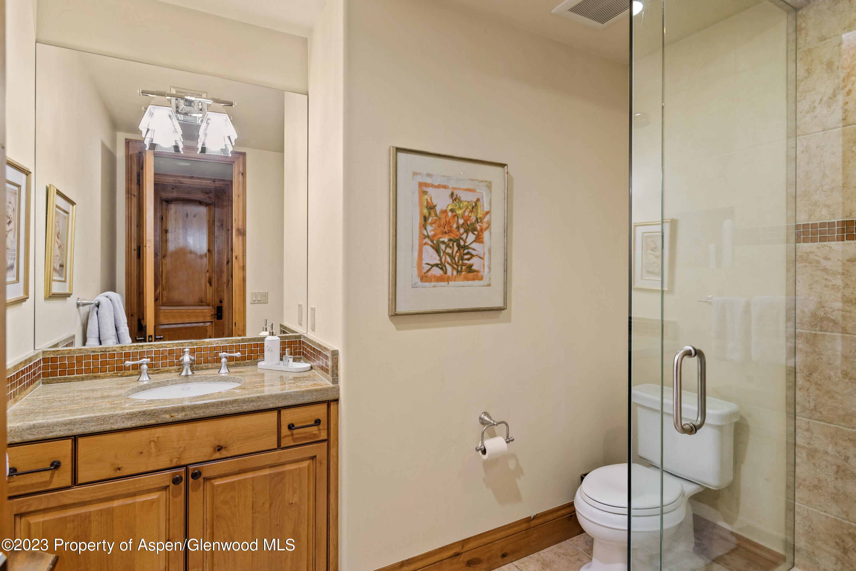 121 Ridge Road Basalt, CO 81621 - Photo 22 of 25 a bathroom with a toilet sink and mirror