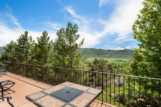 a view of a balcony with a lake view