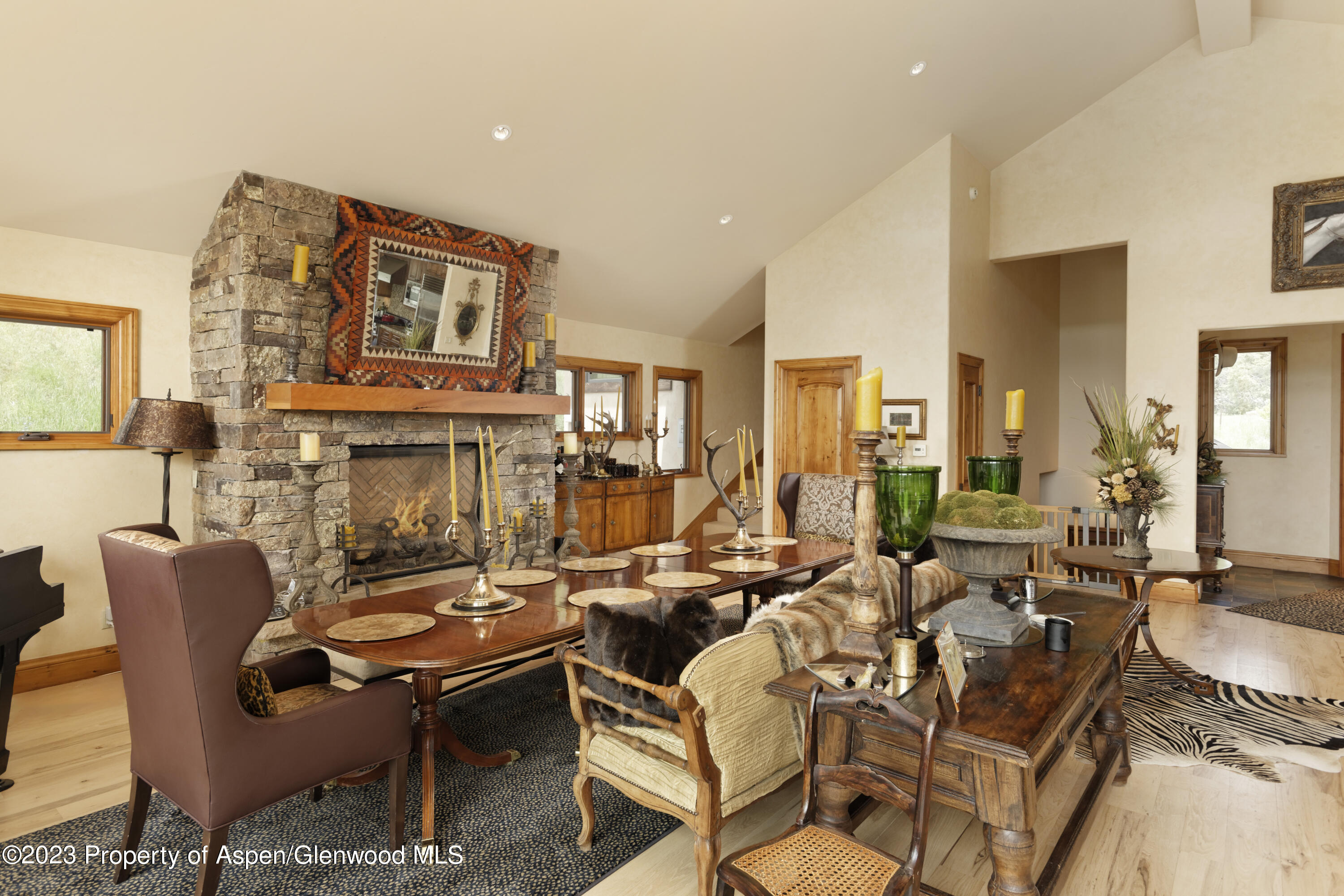 121 Ridge Road Basalt, CO 81621 - Photo 9 of 25 a living room with fireplace furniture and a large window