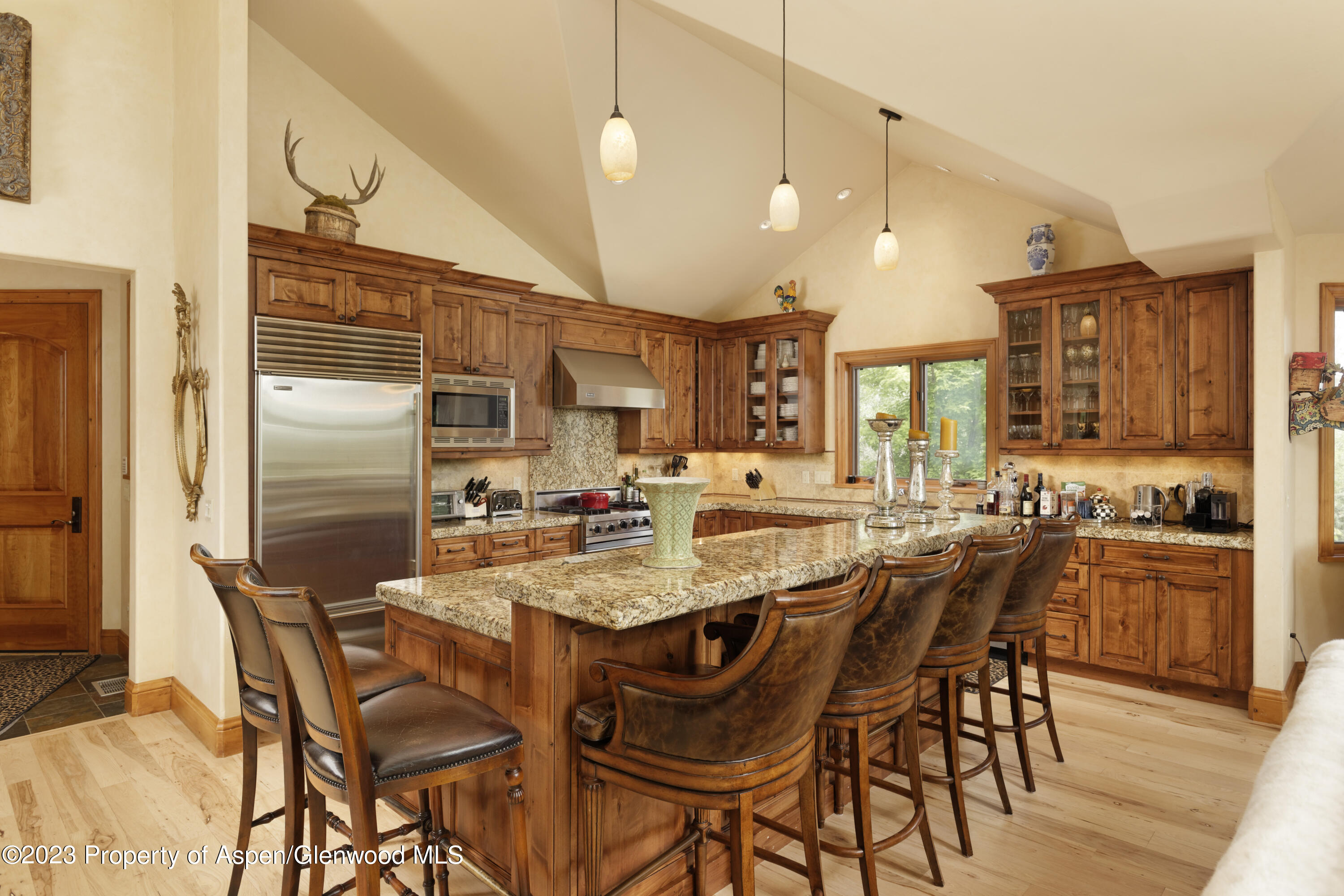 121 Ridge Road Basalt, CO 81621 - Photo 10 of 25 a dining table with chairs and wooden floor
