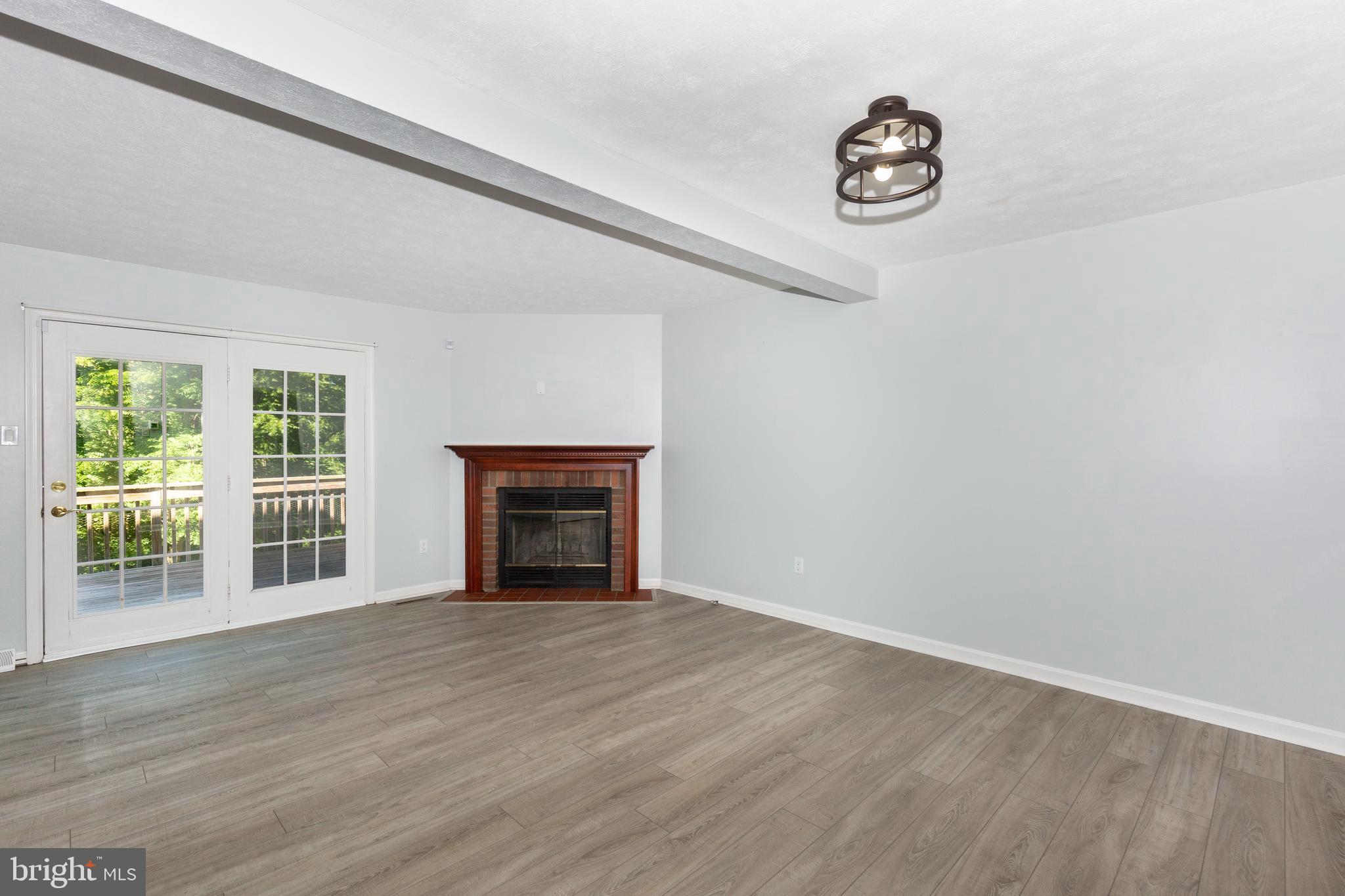 882 Gaming Square Hampstead, MD 21074 - Photo 12 of 46 Dining/Living Room combined with Wood fireplace