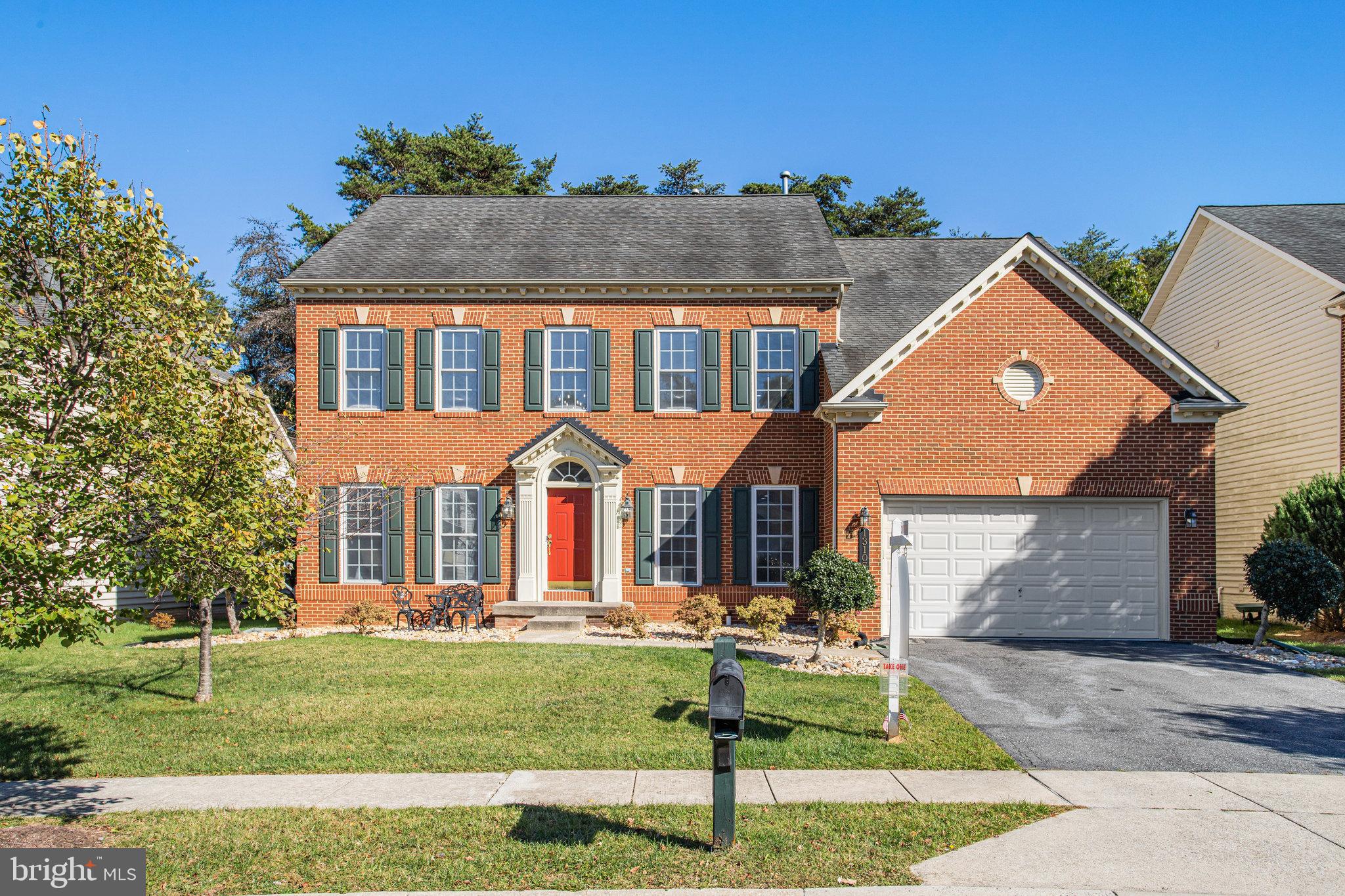 13107 English Turn Drive Silver Spring, MD 20904 - Photo 1 of 73 a front view of house with yard and green space