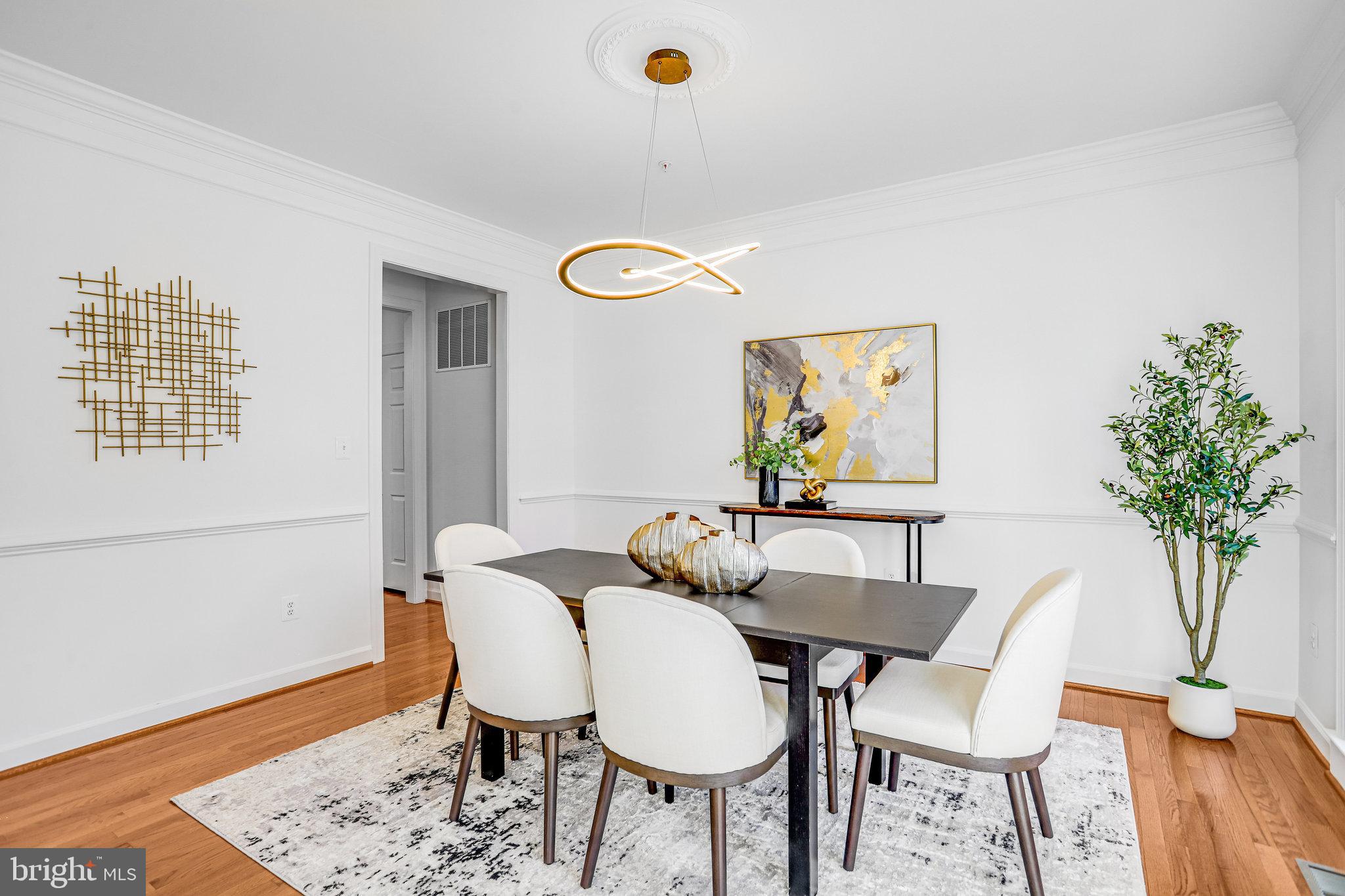 13107 English Turn Drive Silver Spring, MD 20904 - Photo 11 of 73 a view of a dining room with furniture and wooden floor