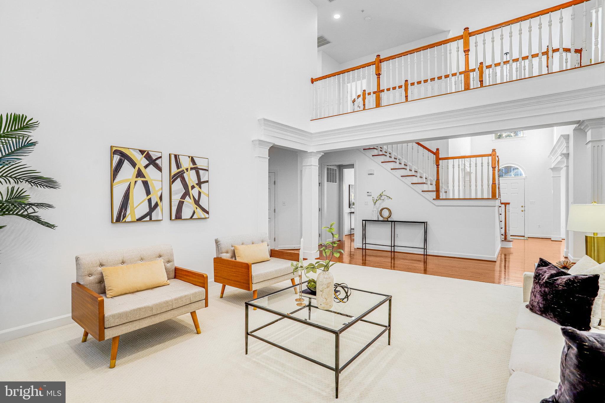 13107 English Turn Drive Silver Spring, MD 20904 - Photo 18 of 73 a living room with furniture a rug and a wall painting