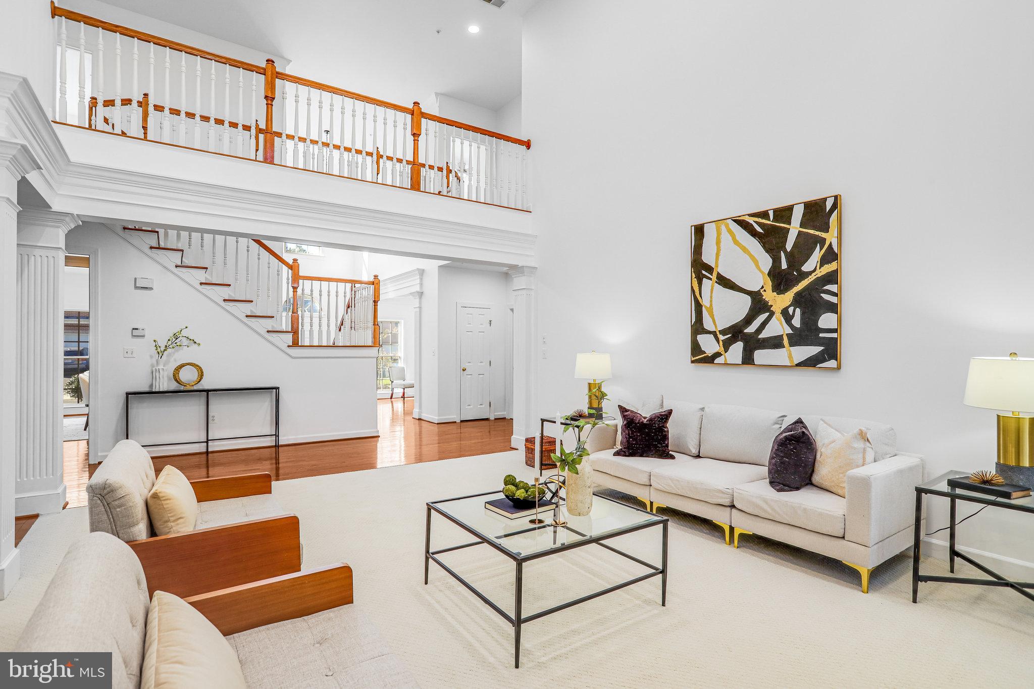 13107 English Turn Drive Silver Spring, MD 20904 - Photo 19 of 73 a living room with furniture a rug and a wall painting