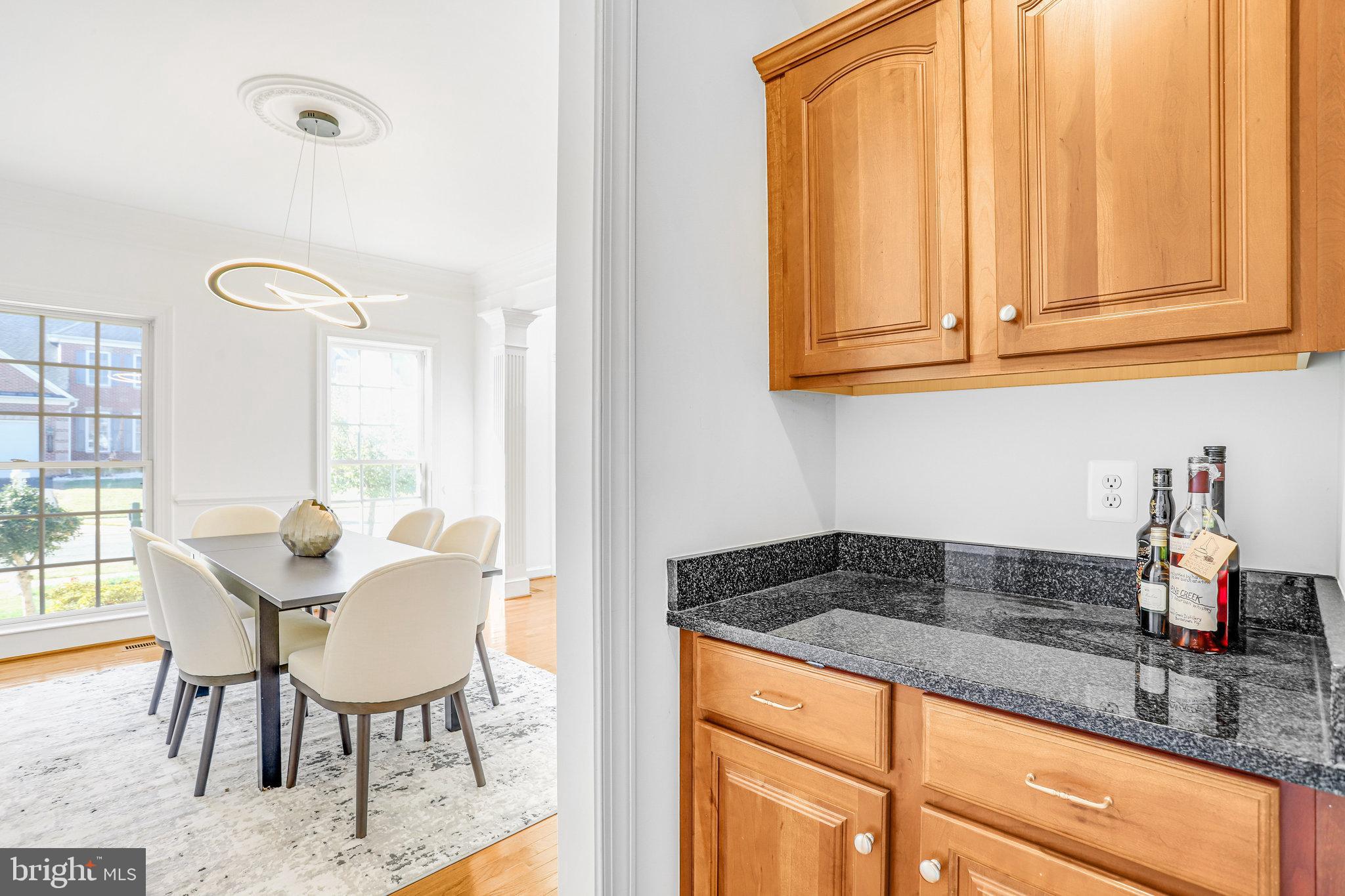 13107 English Turn Drive Silver Spring, MD 20904 - Photo 20 of 73 a kitchen with stainless steel appliances granite countertop a sink and cabinets