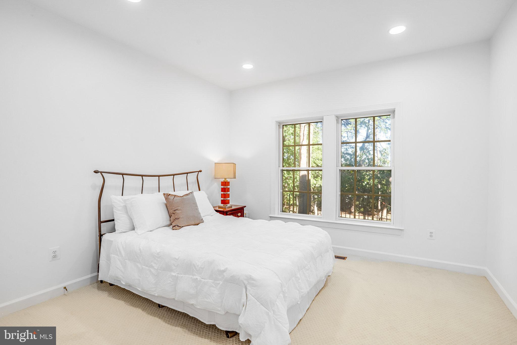 13107 English Turn Drive Silver Spring, MD 20904 - Photo 23 of 73 a bedroom with a large bed and a window