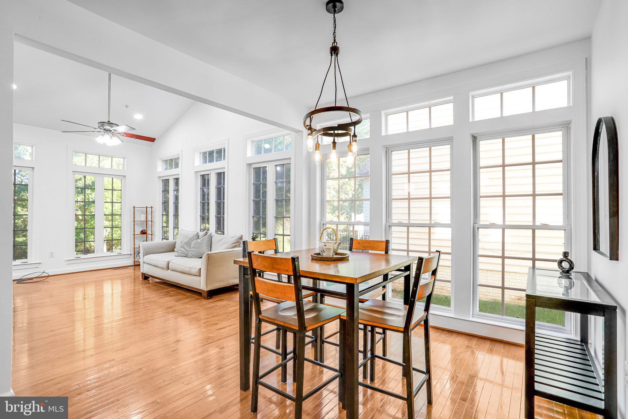 13107 English Turn Drive Silver Spring, MD 20904 - Photo 32 of 73 a view of a dining room with furniture wooden floor and a chandelier