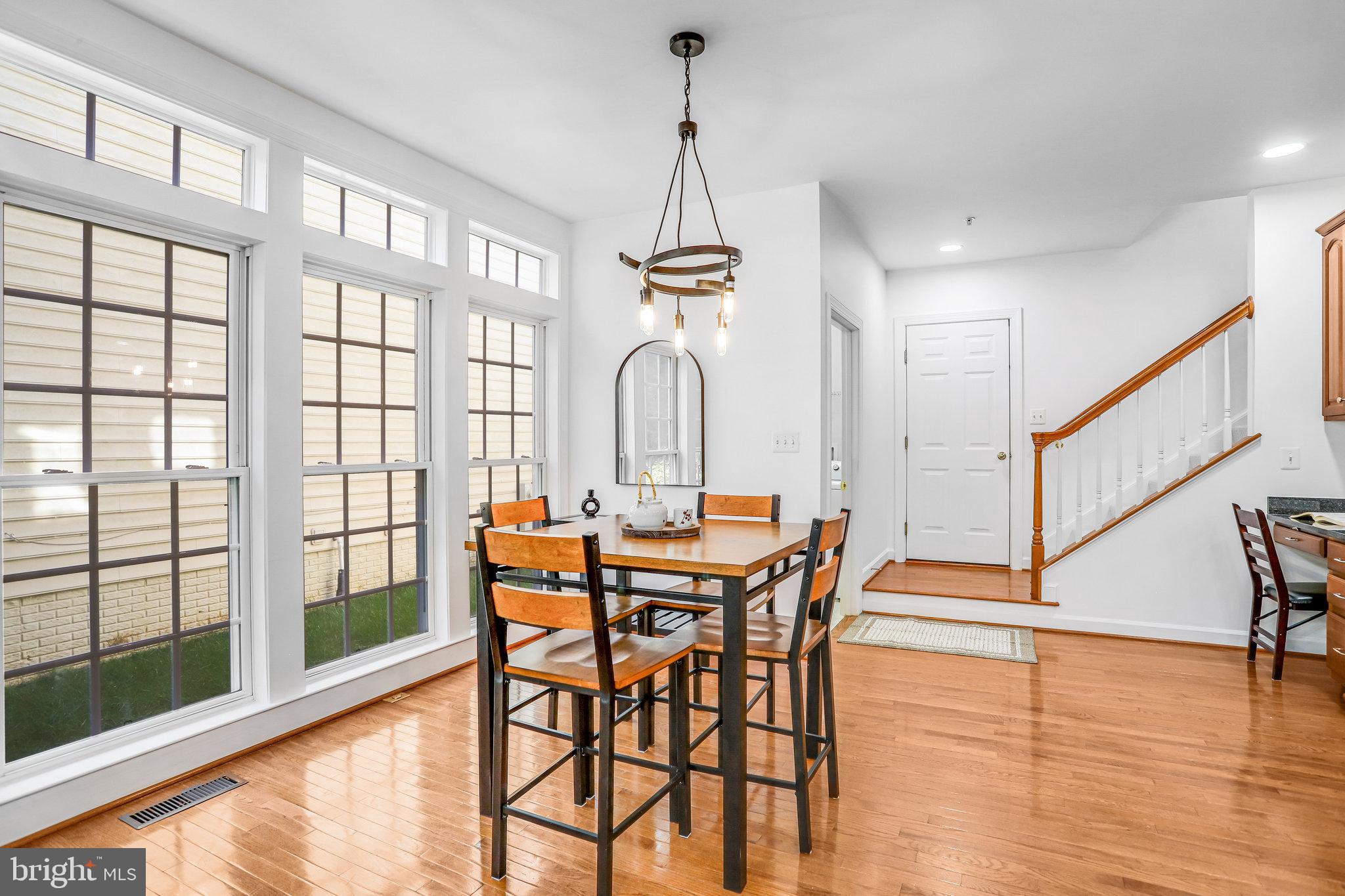 13107 English Turn Drive Silver Spring, MD 20904 - Photo 34 of 73 a view of a dining room with furniture window and wooden floor