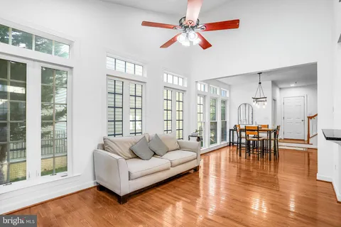 a spacious bedroom with a bed a couch and a couch