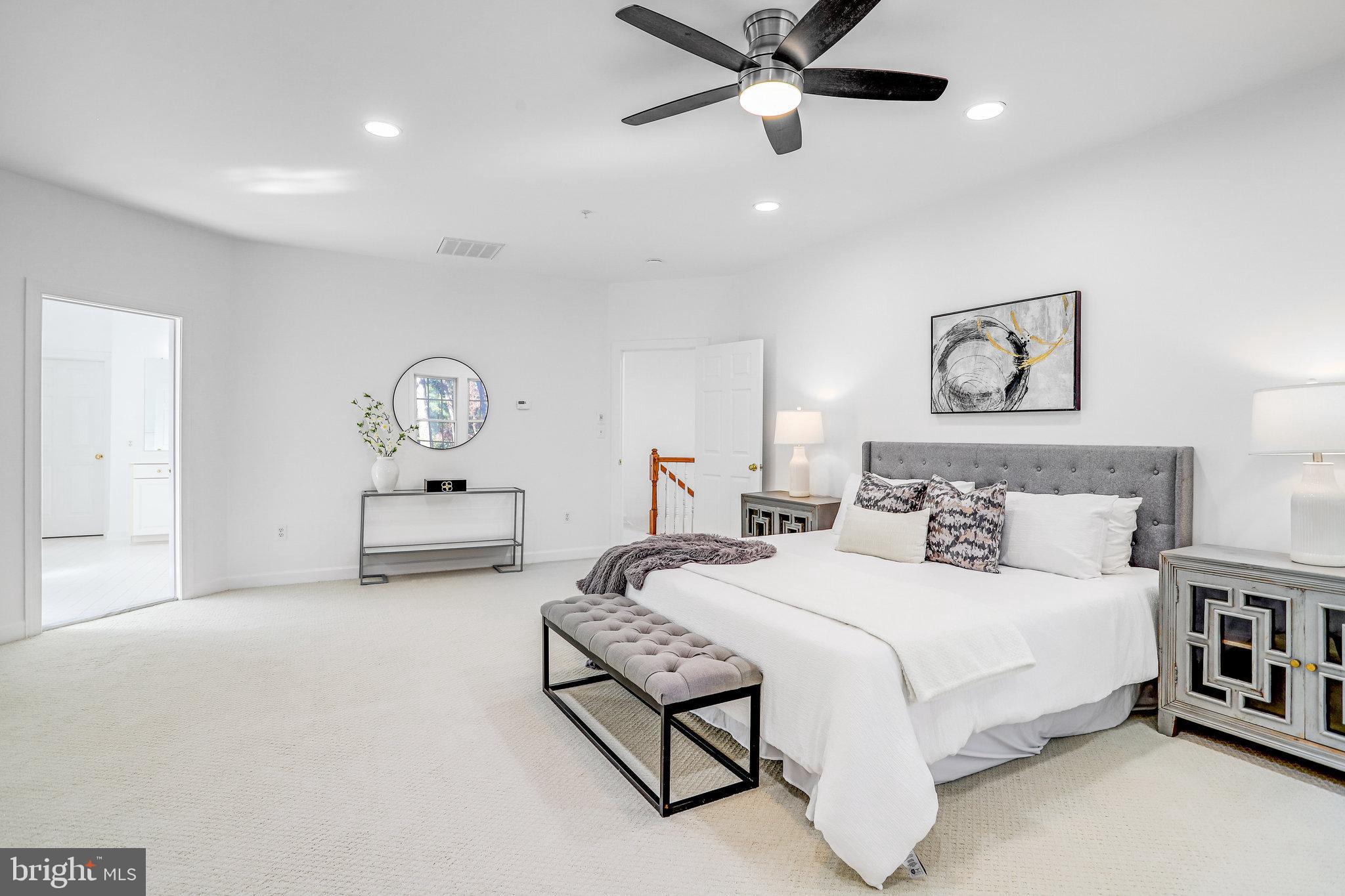 13107 English Turn Drive Silver Spring, MD 20904 - Photo 45 of 73 a bedroom with a bed and a painting on the wall