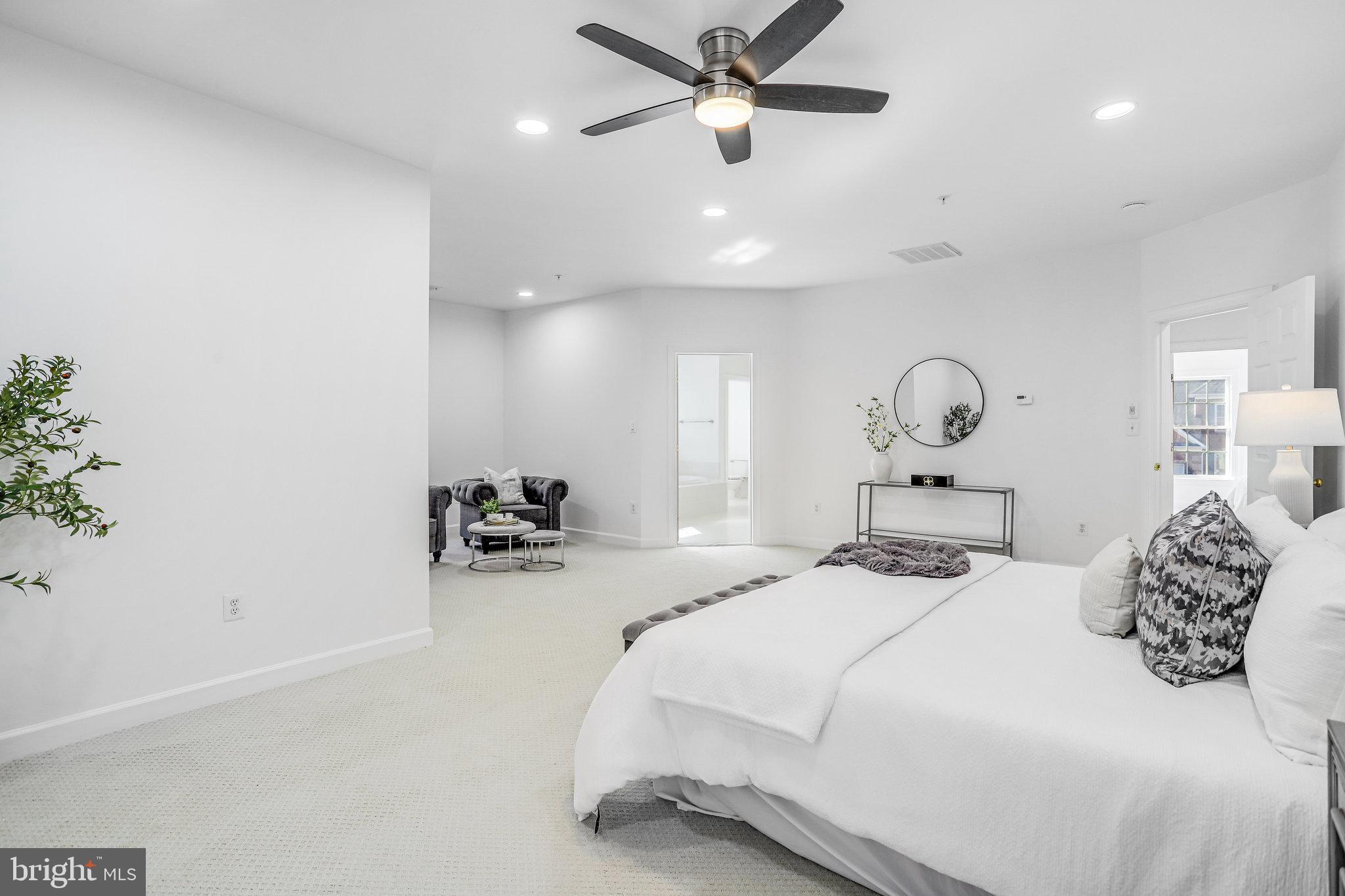 13107 English Turn Drive Silver Spring, MD 20904 - Photo 46 of 73 a bedroom with a bed and a chandelier