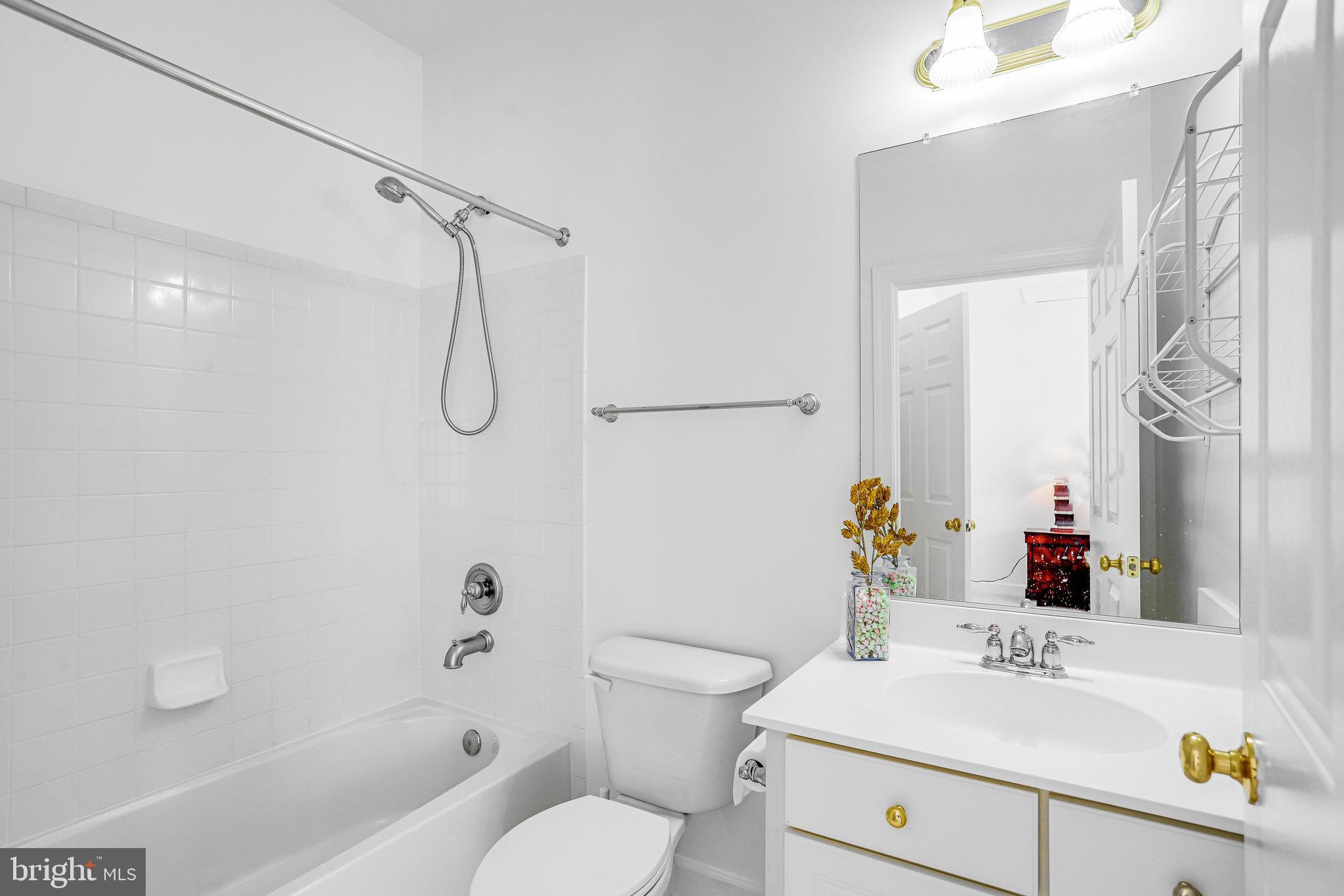 13107 English Turn Drive Silver Spring, MD 20904 - Photo 55 of 73 a bathroom with a sink vanity mirror and toilet