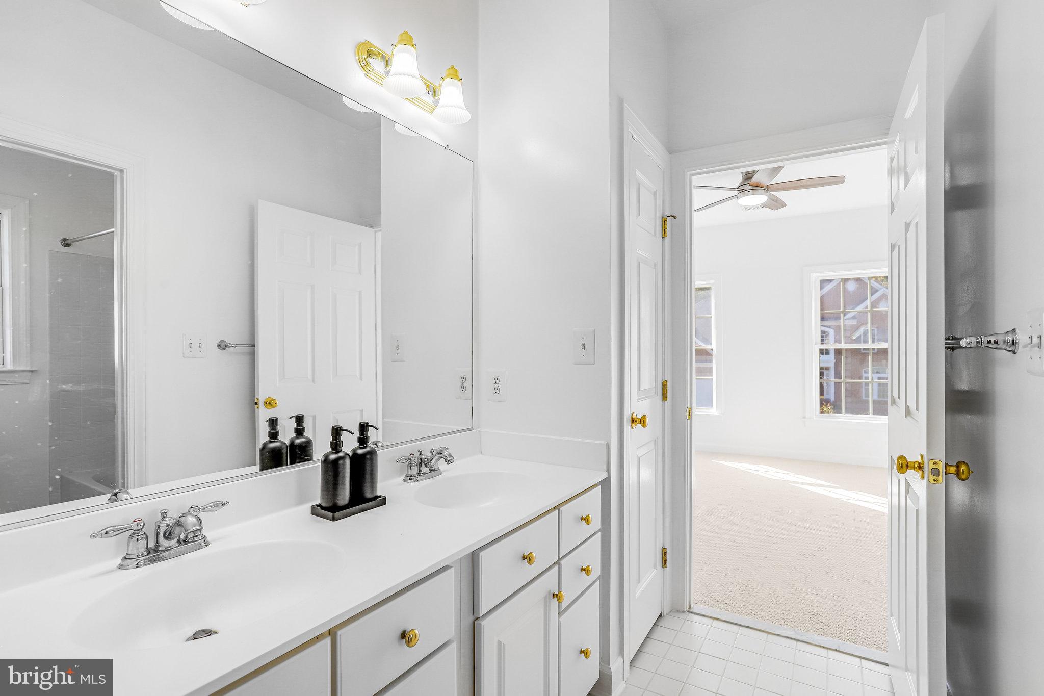 13107 English Turn Drive Silver Spring, MD 20904 - Photo 59 of 73 a bathroom with a sink vanity tub and shower