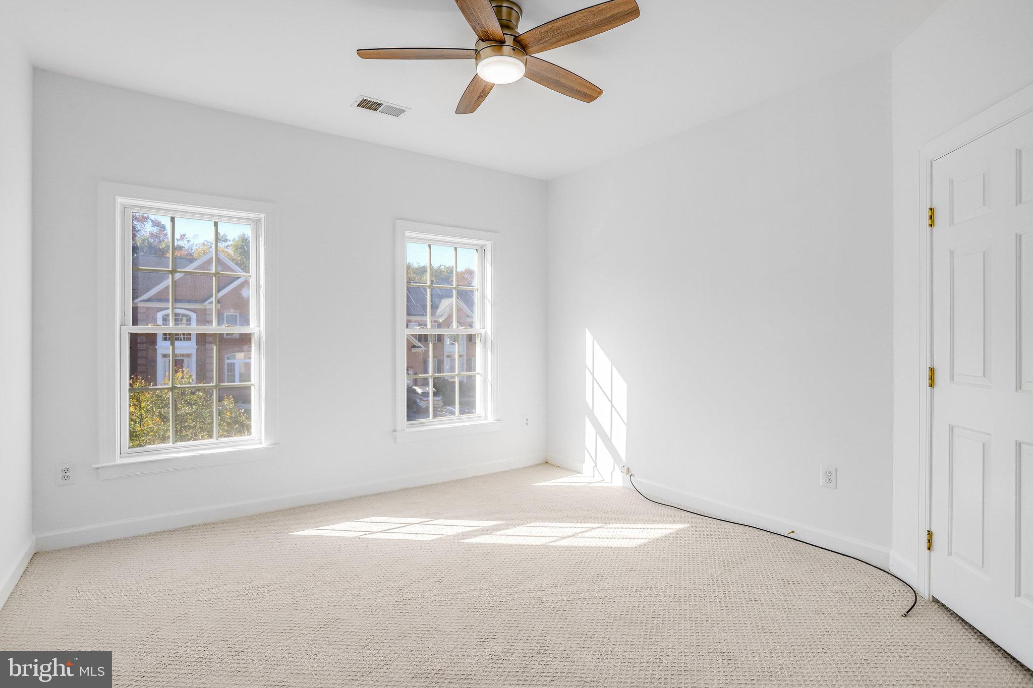 13107 English Turn Drive Silver Spring, MD 20904 - Photo 60 of 73 an empty room with windows and fan