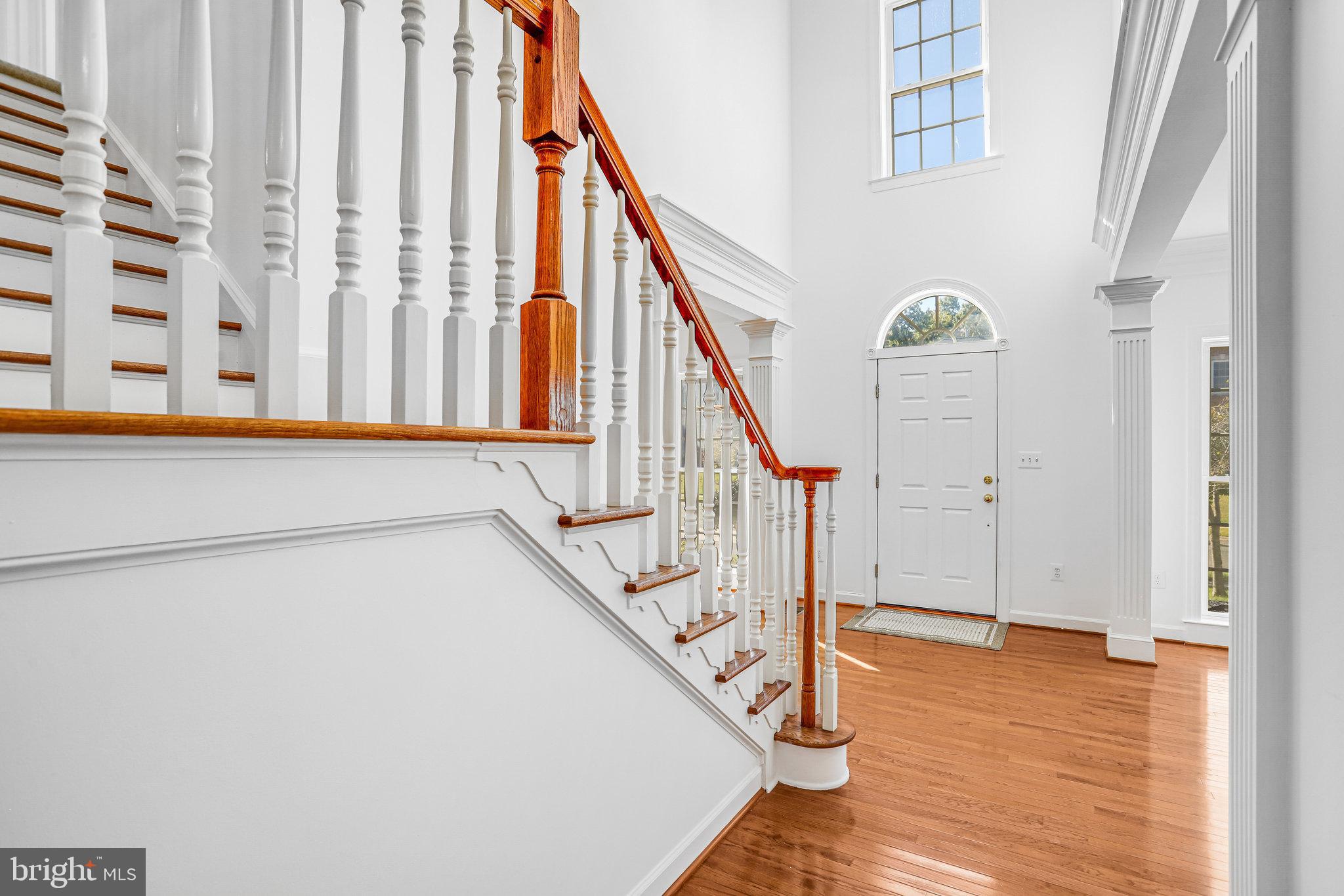 13107 English Turn Drive Silver Spring, MD 20904 - Photo 6 of 73 a view of staircase with lots of frames on wall and wooden floor