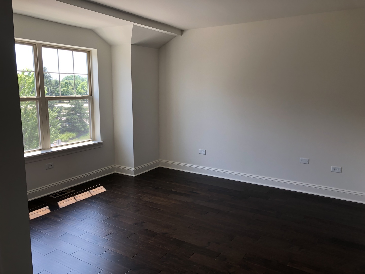 1234 Byrne Boulevard Vernon Hills, IL 60061 - Photo 8 of 12 an empty room with wooden floor and windows