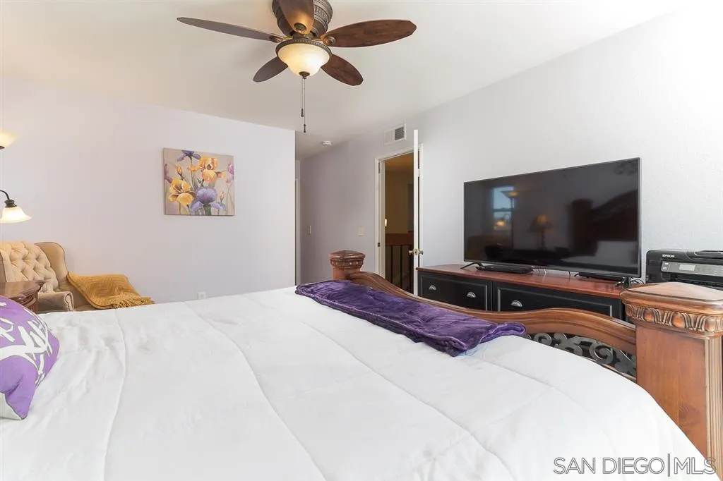 11027 Eddington Road Santee, CA 92071 - Photo 15 of 25 a bedroom with a bed and a flat screen tv