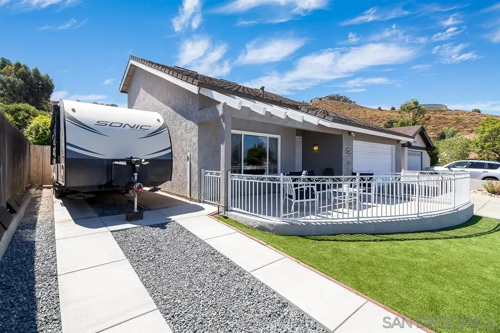 11027 Eddington Road Santee, CA 92071 - Photo 2 of 25 a view of house with a patio and deck