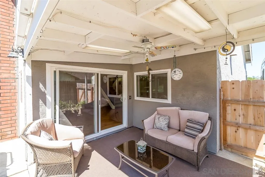 11027 Eddington Road Santee, CA 92071 - Photo 22 of 25 a living room with furniture and a large window
