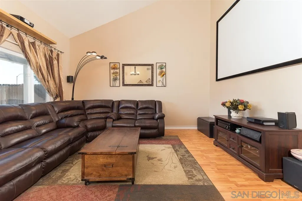11027 Eddington Road Santee, CA 92071 - Photo 5 of 25 a living room with furniture and wooden floor