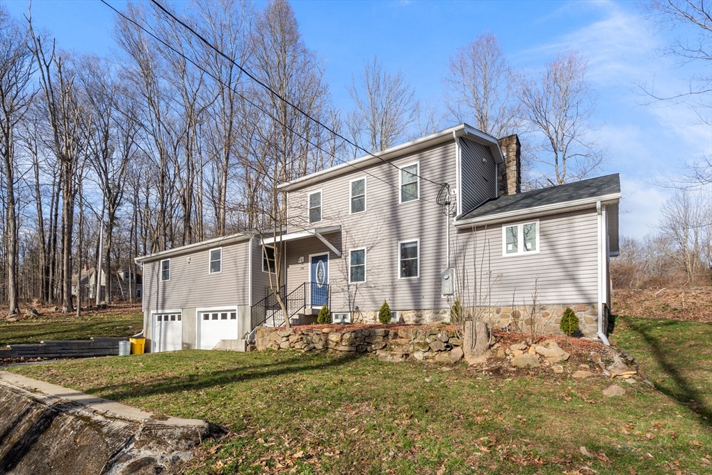 146 Warren Road Brimfield, MA 01010 - Photo 30 of 30 a view of a house with a yard