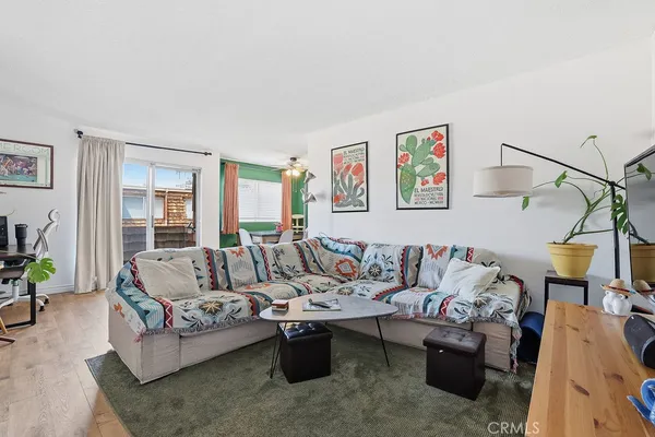 a living room with furniture rug and window