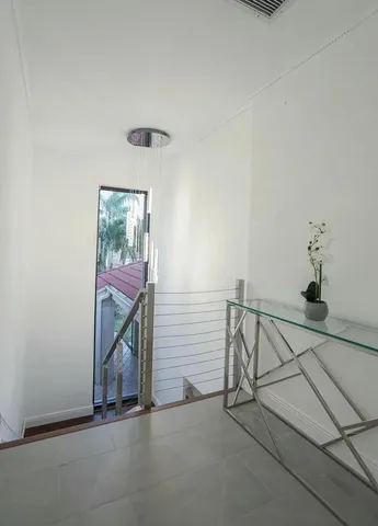 a bedroom with a bed and large window