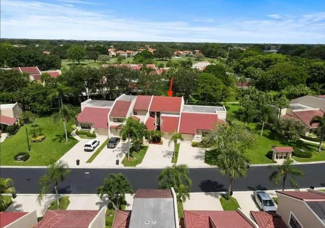 an aerial view of a house with a garden