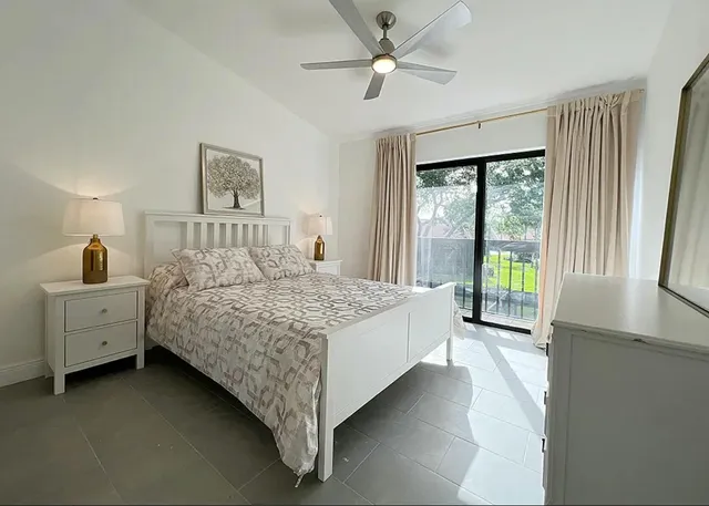 a bathroom with a toilet sink and shower