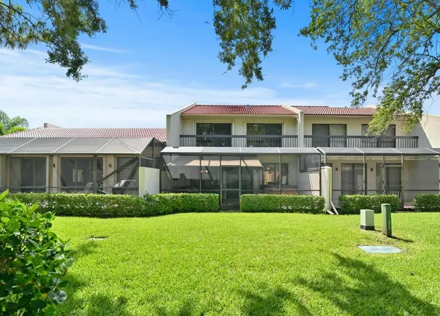 an aerial view of house with yard swimming pool and outdoor seating