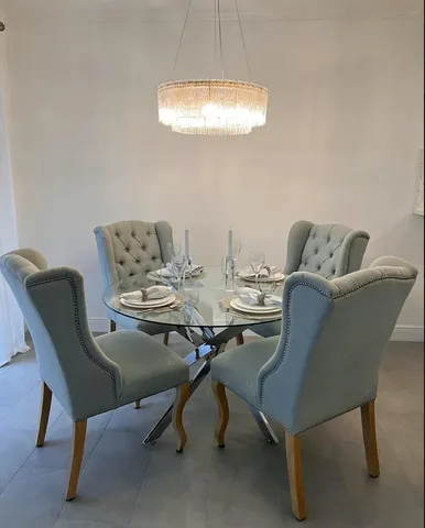 a living room with furniture a window and a table