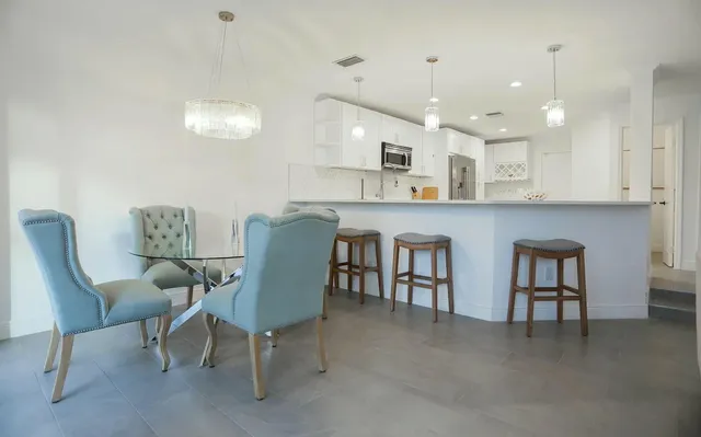 a view of kitchen with cabinets and wooden floor