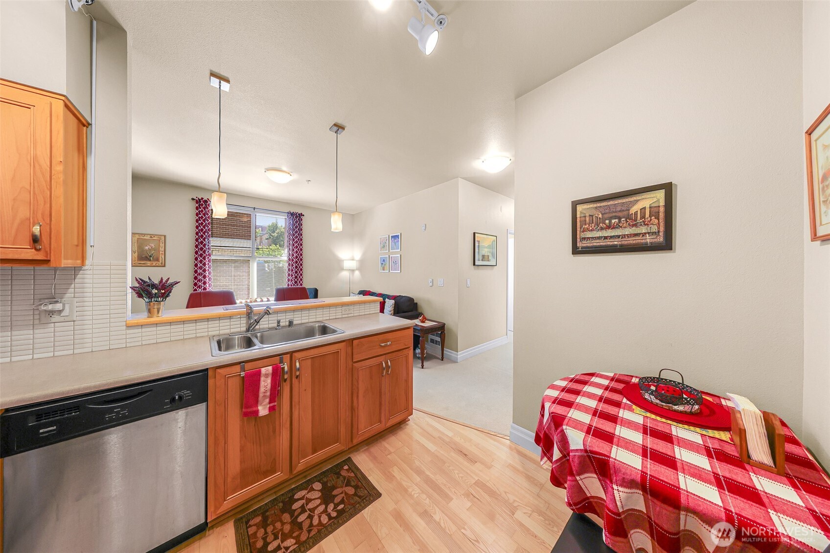 910 Harris Avenue, Unit 208 Bellingham, WA 98225 - Photo 13 of 33 a kitchen with kitchen island a sink stainless steel appliances and cabinets
