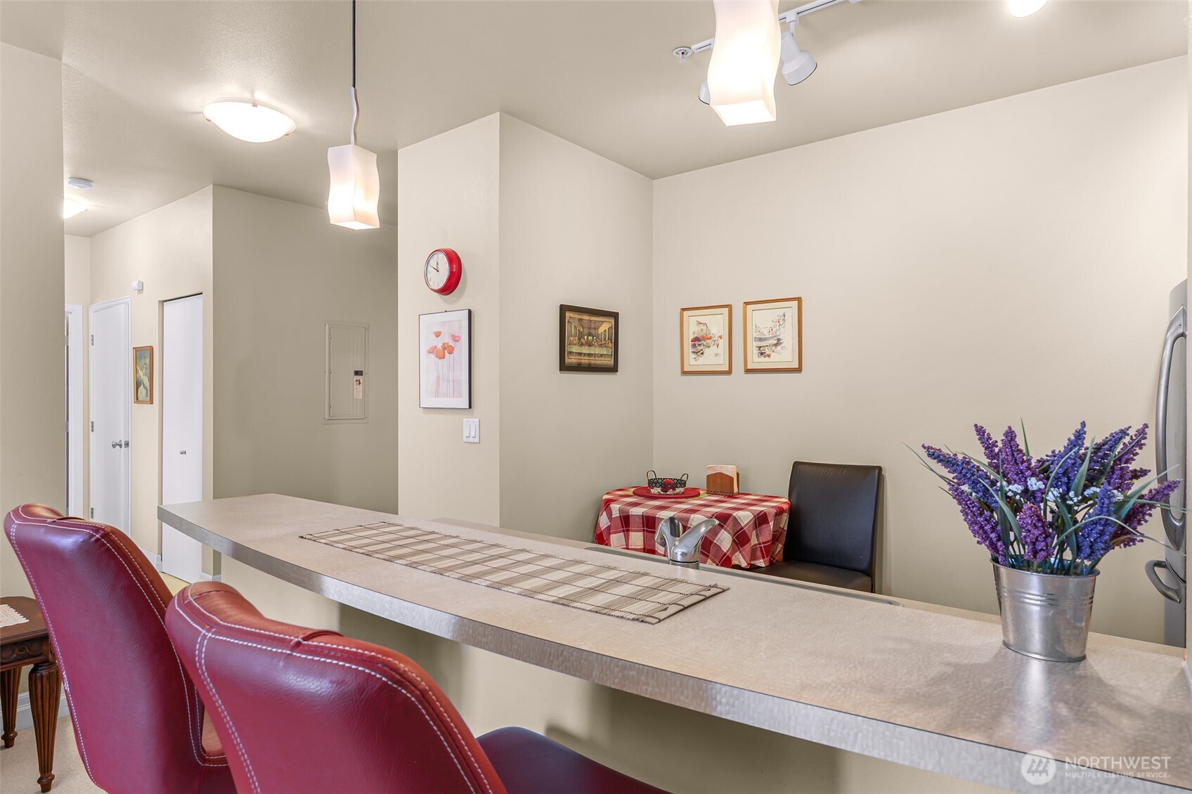 910 Harris Avenue, Unit 208 Bellingham, WA 98225 - Photo 16 of 33 a bedroom with a bed and a chandelier