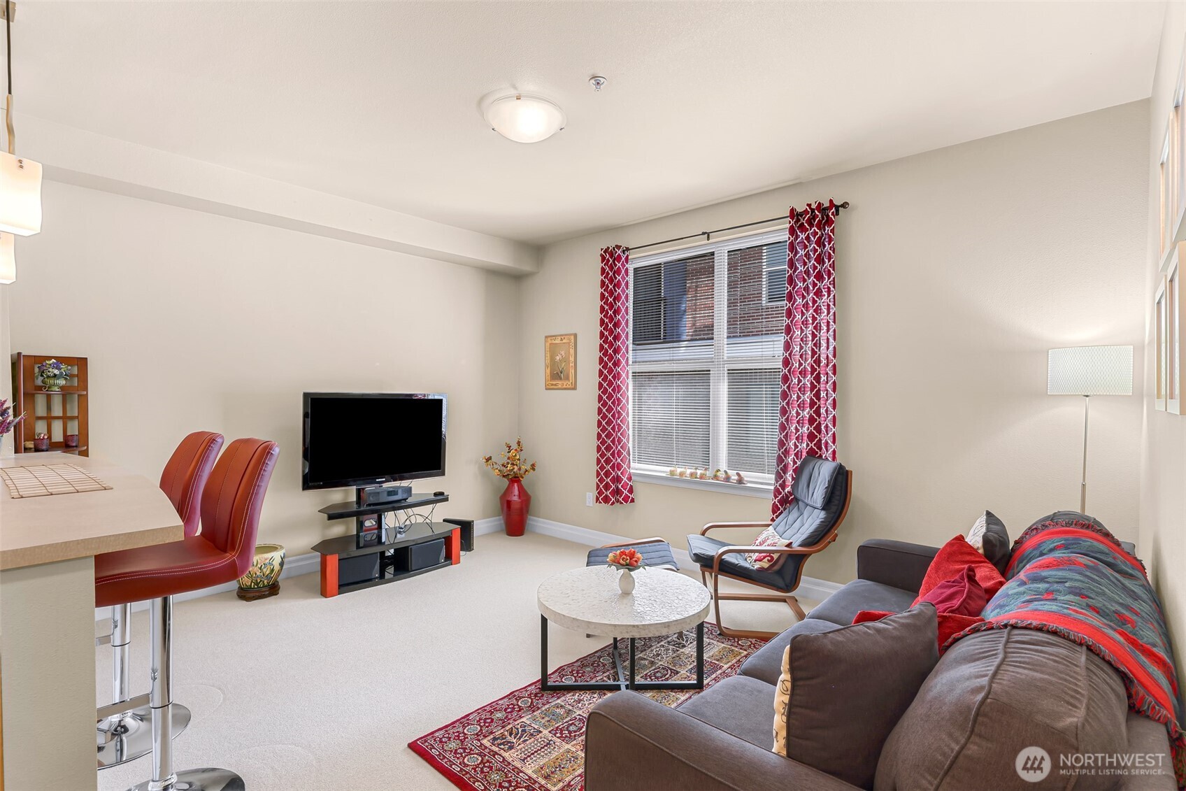 910 Harris Avenue, Unit 208 Bellingham, WA 98225 - Photo 18 of 33 a living room with furniture and a flat screen tv