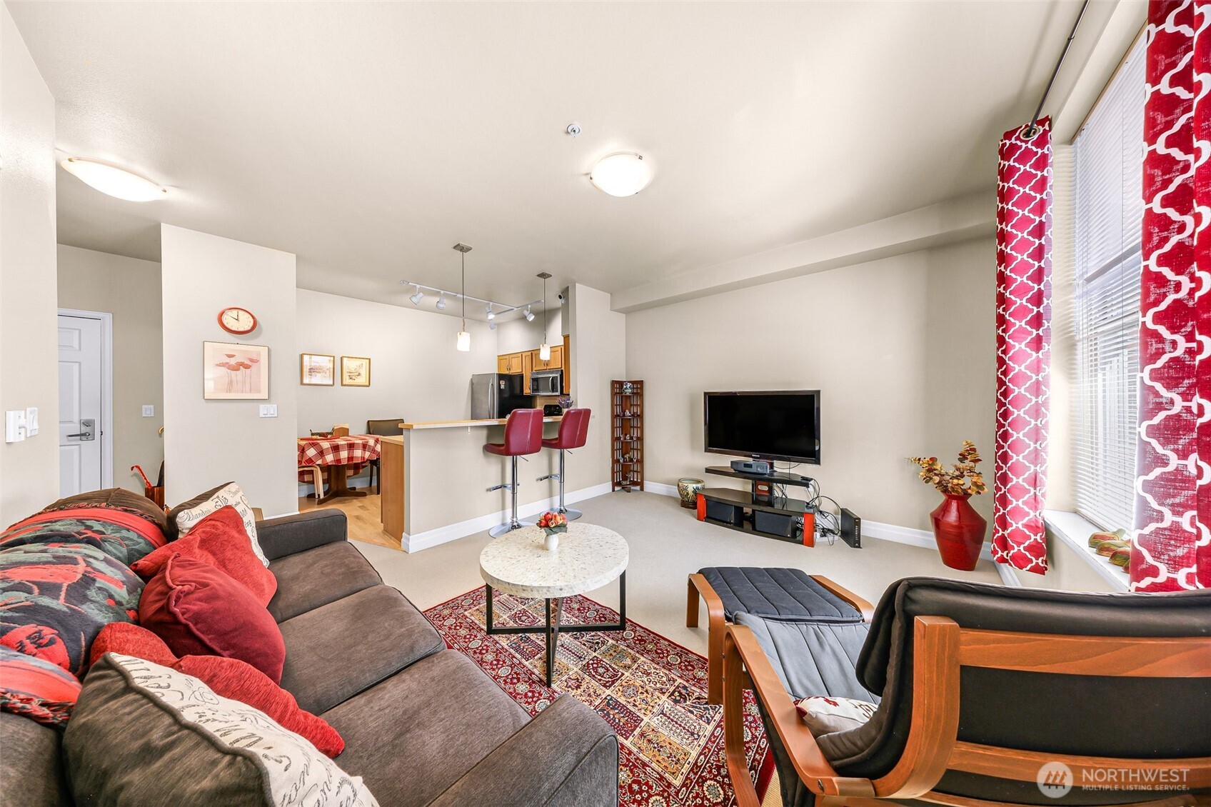 910 Harris Avenue, Unit 208 Bellingham, WA 98225 - Photo 22 of 33 a living room with furniture and a flat screen tv