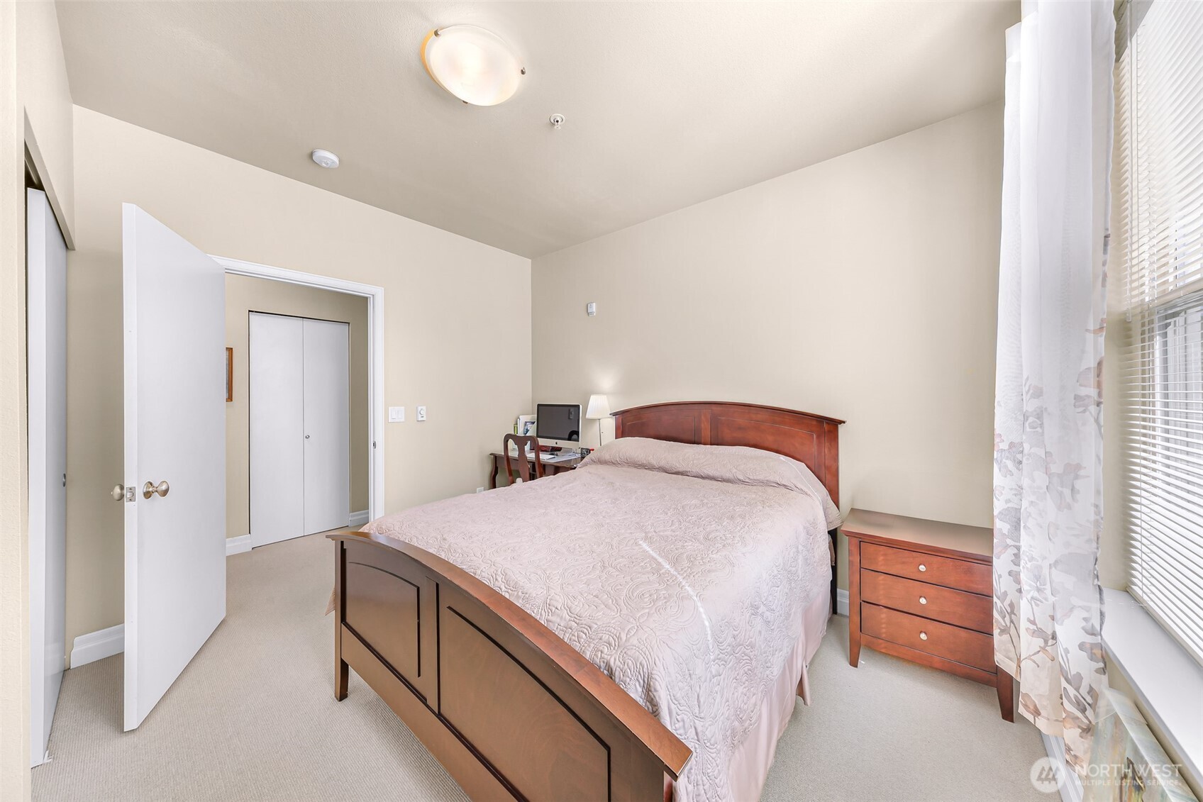 910 Harris Avenue, Unit 208 Bellingham, WA 98225 - Photo 25 of 33 a bedroom with a bed and a cabinets