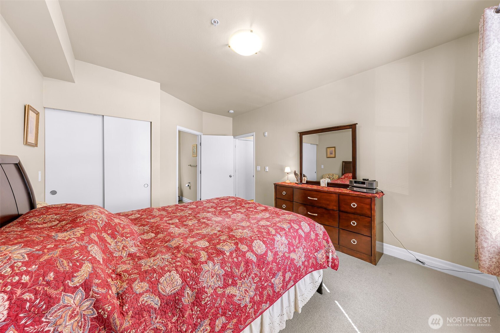 910 Harris Avenue, Unit 208 Bellingham, WA 98225 - Photo 28 of 33 a bedroom with a bed and a dresser