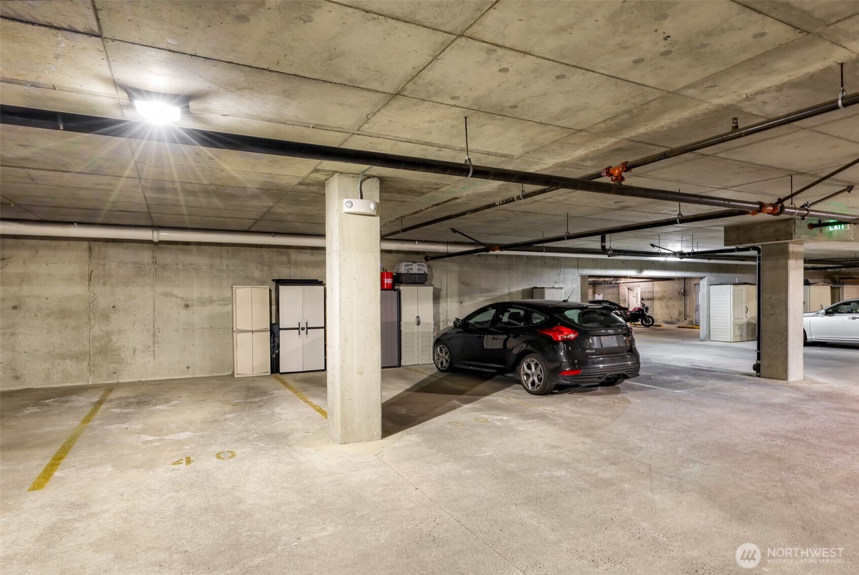 910 Harris Avenue, Unit 208 Bellingham, WA 98225 - Photo 30 of 33 a car parked in a garage