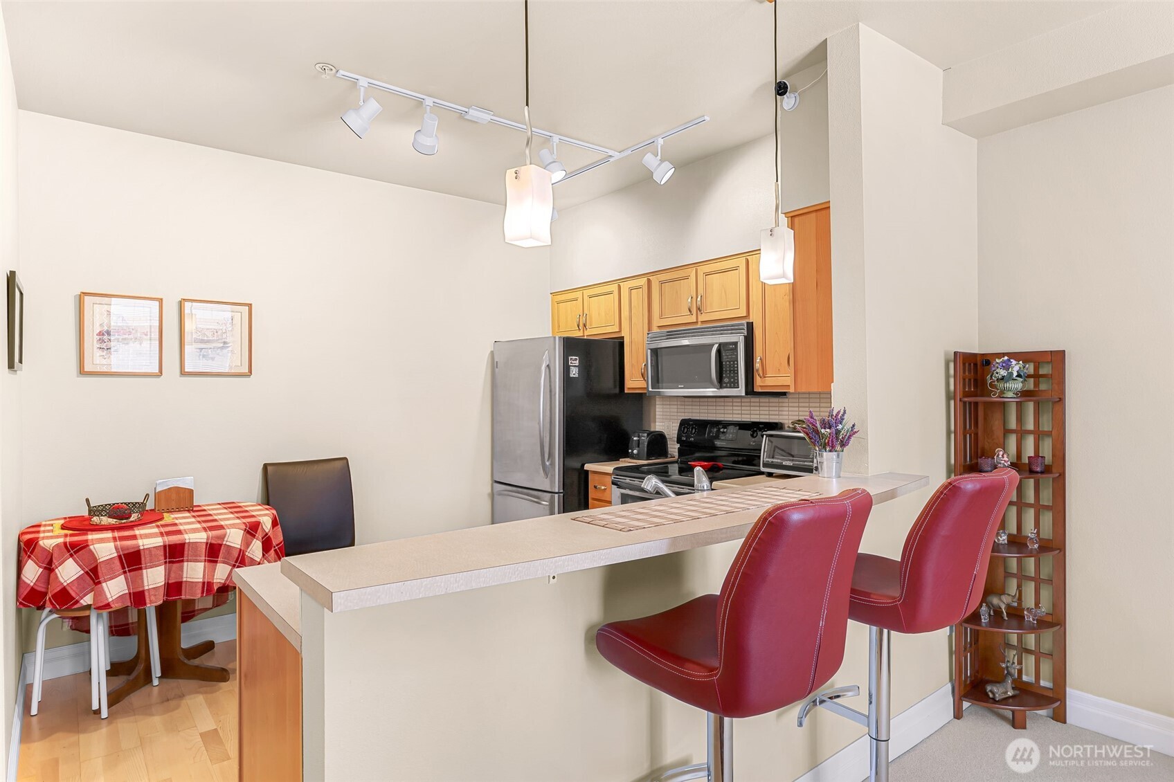 910 Harris Avenue, Unit 208 Bellingham, WA 98225 - Photo 10 of 33 a living room with furniture and a flat screen tv