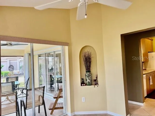a en suite bathroom with a granite countertop sink and a mirror