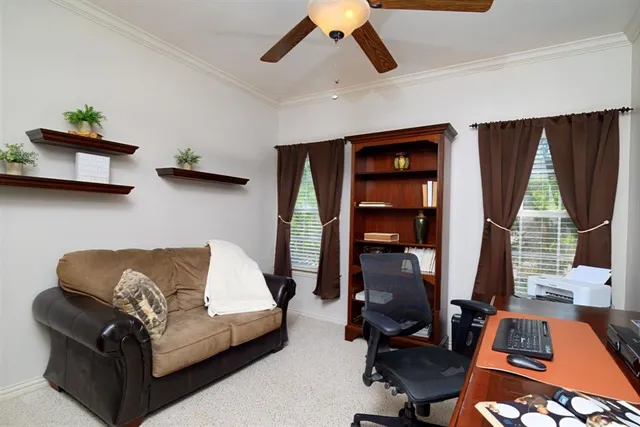 a kitchen with a refrigerator sink and cabinets