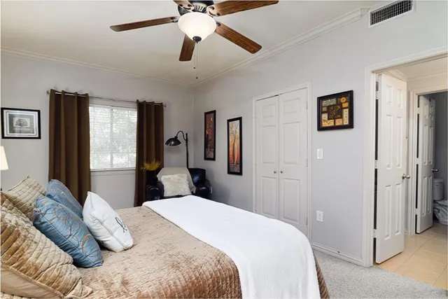 a bathroom with a toilet and shower