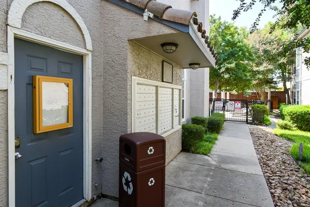 a view of a hallway with a chandelier