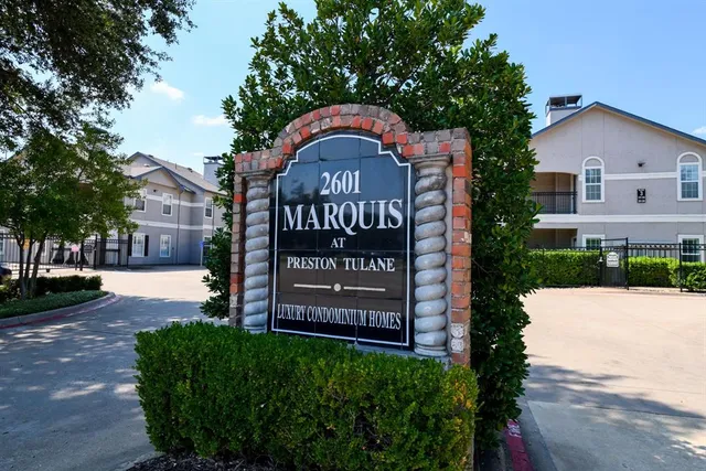 a view of a street with a building in the background