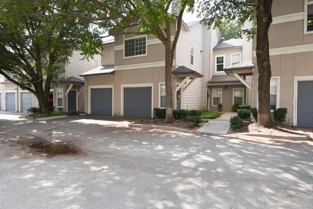a view of a white house with a outdoor space