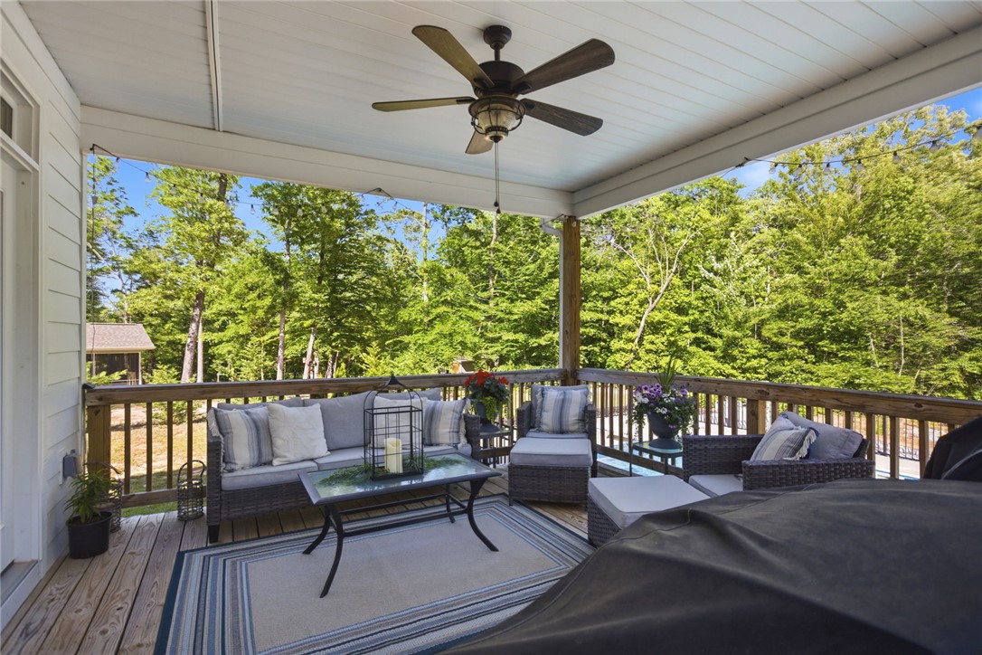 525 16th Circle Walhalla, SC 29691 - Photo 34 of 50 This spacious covered deck offers a serene outdoor retreat, perfect for relaxation and enjoying the lush surroundings.